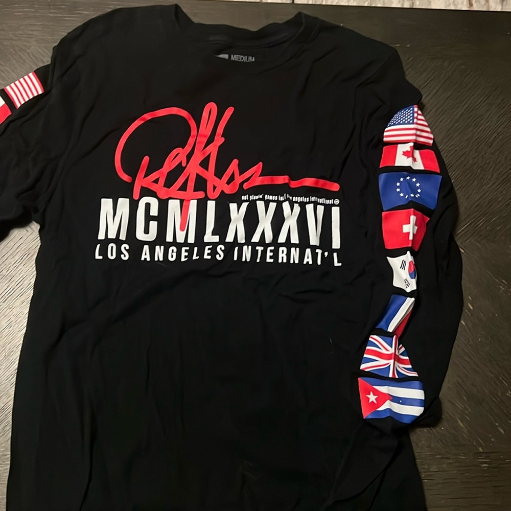 Black Long Sleeve Los Angeles Shirt w/ featured flags of the world on sleeves